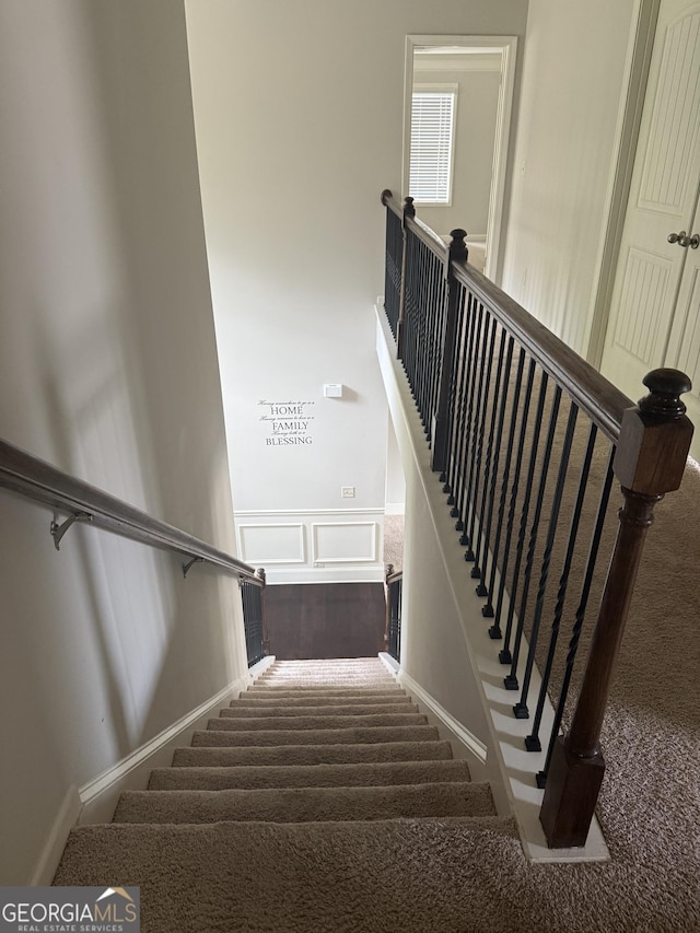 1124 Pebble Creek Ln, Locust Grove, GA 30248 - stairway featuring wainscoting, carpet floors, and a decorative wall