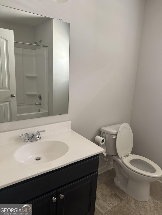 bathroom with vanity, baseboards, shower / bath combination, and toilet