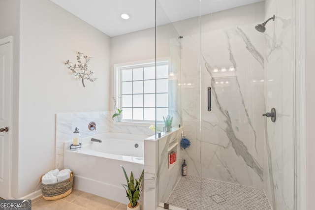 full bath with a marble finish shower, tile patterned floors, and a bath