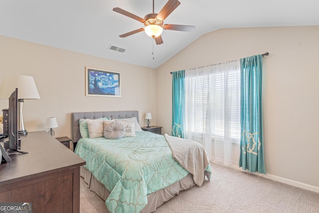 bedroom featuring light colored carpet, ceiling fan, vaulted ceiling, and visible vents