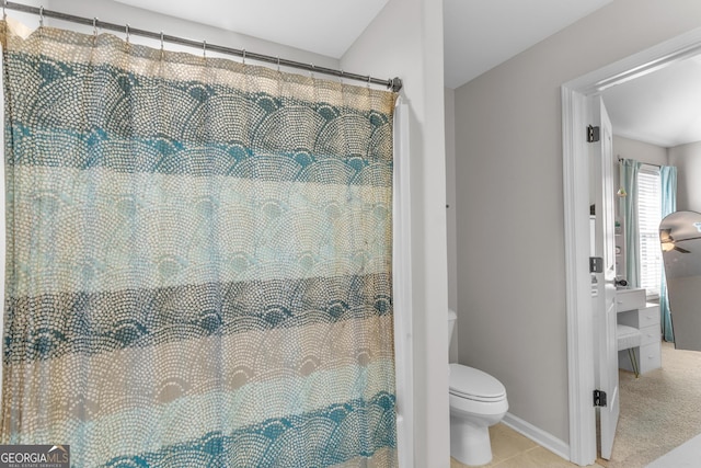 bathroom featuring tile patterned flooring and toilet
