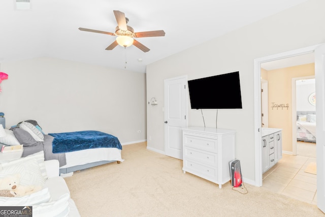 bedroom featuring a ceiling fan, visible vents, light colored carpet, baseboards, and lofted ceiling