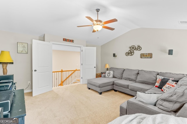 living room with a ceiling fan, carpet, lofted ceiling, and visible vents