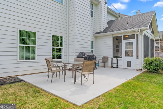 view of patio / terrace with a sunroom
