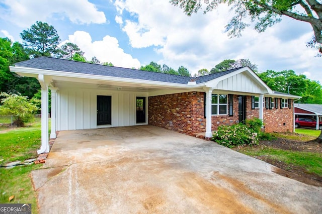 6213 Cherry Ln, Douglasville, GA 30134 - single story home featuring driveway, an attached carport, brick siding, and board and batten siding
