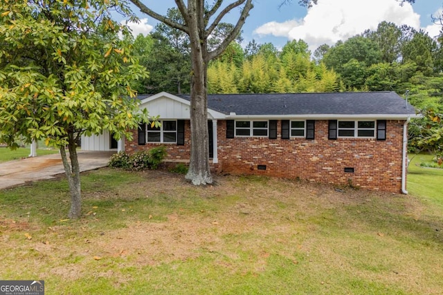 6213 Cherry Ln, Douglasville, GA 30134 - ranch-style house with a front yard, brick siding, crawl space, driveway, and a carport