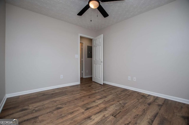 6213 Cherry Ln, Douglasville, GA 30134 - empty room with wood finished floors, baseboards, ceiling fan, and a textured ceiling