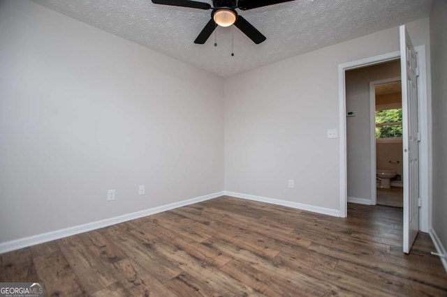 6213 Cherry Ln, Douglasville, GA 30134 - spare room with wood finished floors, ceiling fan, a textured ceiling, and baseboards
