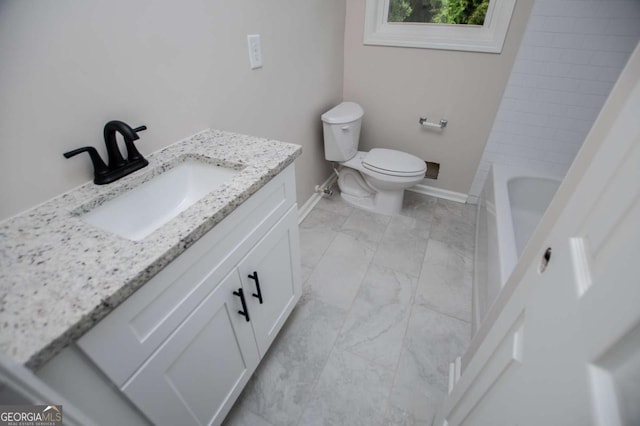 6213 Cherry Ln, Douglasville, GA 30134 - full bath featuring baseboards, toilet, vanity, marble finish flooring, and a tub to relax in