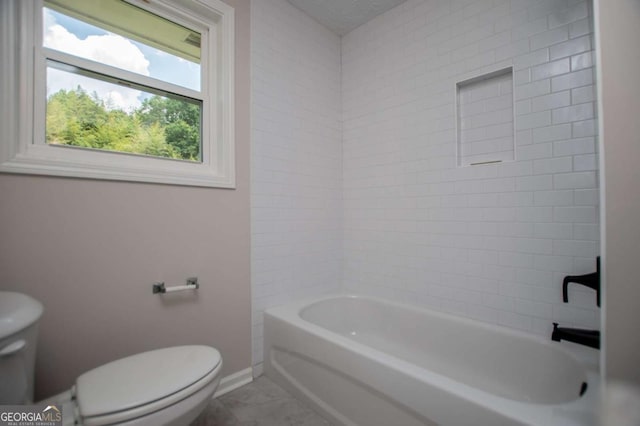 6213 Cherry Ln, Douglasville, GA 30134 - bathroom featuring toilet, baseboards, and washtub / shower combination
