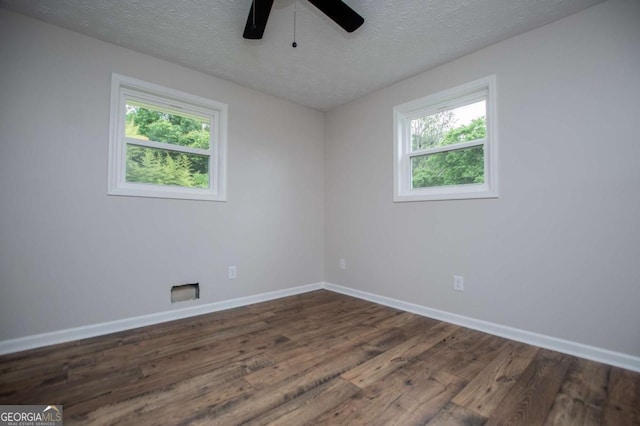 6213 Cherry Ln, Douglasville, GA 30134 - empty room featuring dark wood finished floors, baseboards, ceiling fan, and a textured ceiling
