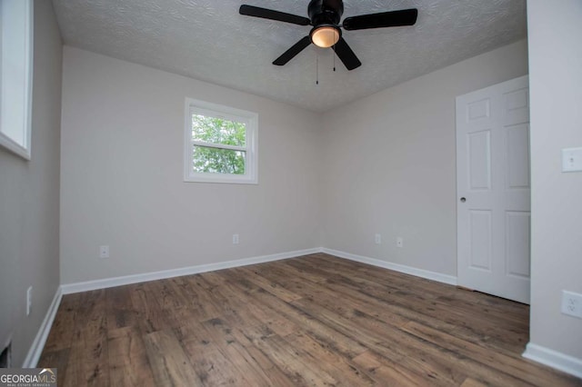 6213 Cherry Ln, Douglasville, GA 30134 - unfurnished room with wood finished floors, a textured ceiling, a ceiling fan, and baseboards