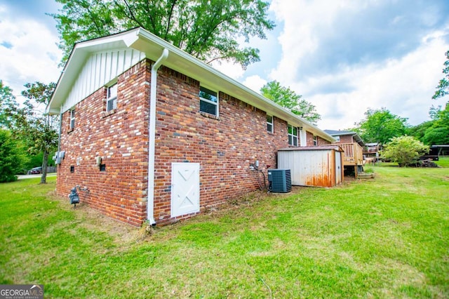 6213 Cherry Ln, Douglasville, GA 30134 - view of property exterior with board and batten siding, brick siding, cooling unit, and a lawn
