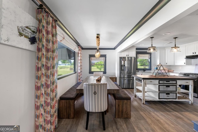 1601 Arrowhead Rd, Greensboro, GA 30642 - dining space featuring ornamental molding and dark wood-style floors