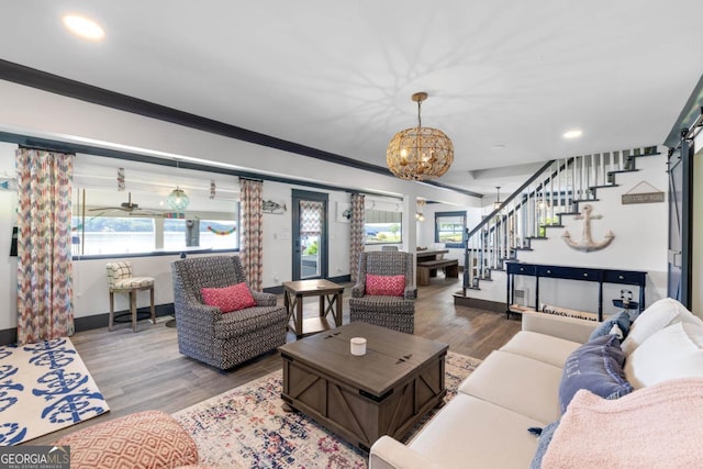 1601 Arrowhead Rd, Greensboro, GA 30642 - living room with stairs, wood finished floors, baseboards, a chandelier, and recessed lighting