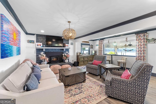 1601 Arrowhead Rd, Greensboro, GA 30642 - living room featuring crown molding, recessed lighting, wood finished floors, and a fireplace