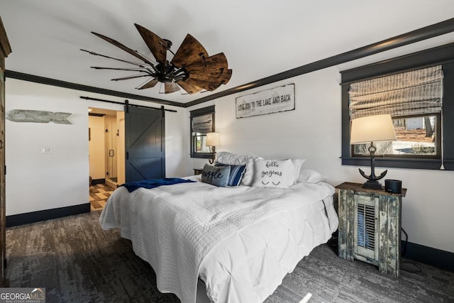 1601 Arrowhead Rd, Greensboro, GA 30642 - bedroom featuring baseboards, multiple windows, a barn door, and wood finished floors