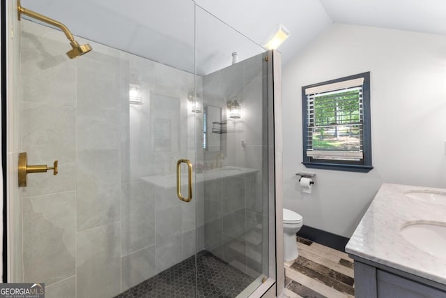 1601 Arrowhead Rd, Greensboro, GA 30642 - bathroom featuring double vanity, lofted ceiling, a stall shower, and toilet