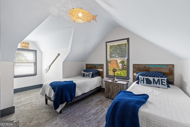 1601 Arrowhead Rd, Greensboro, GA 30642 - bedroom with multiple windows, wood finished floors, and lofted ceiling
