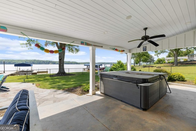 1601 Arrowhead Rd, Greensboro, GA 30642 - view of patio with fence, a water view, a hot tub, and ceiling fan
