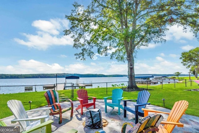 1601 Arrowhead Rd, Greensboro, GA 30642 - view of patio featuring a water view, fence, and a fire pit