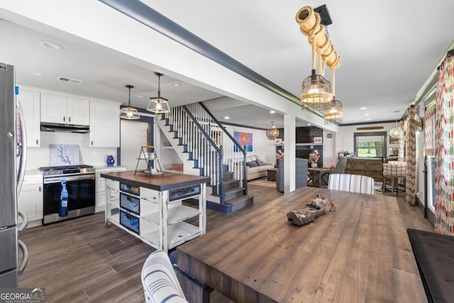 1601 Arrowhead Rd, Greensboro, GA 30642 - dining area with stairs, recessed lighting, visible vents, and dark wood-style floors