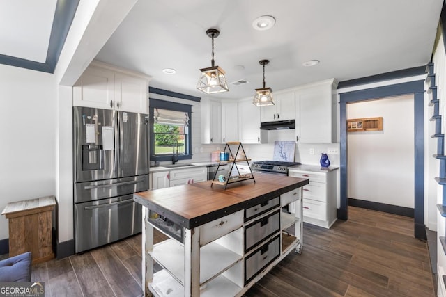 1601 Arrowhead Rd, Greensboro, GA 30642 - kitchen with wooden counters, visible vents, appliances with stainless steel finishes, white cabinets, and under cabinet range hood