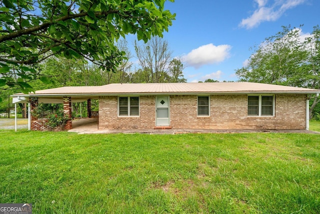 3011 Refuge Rd, Jasper, GA 30143 - ranch-style home with brick siding, a front lawn, and a carport