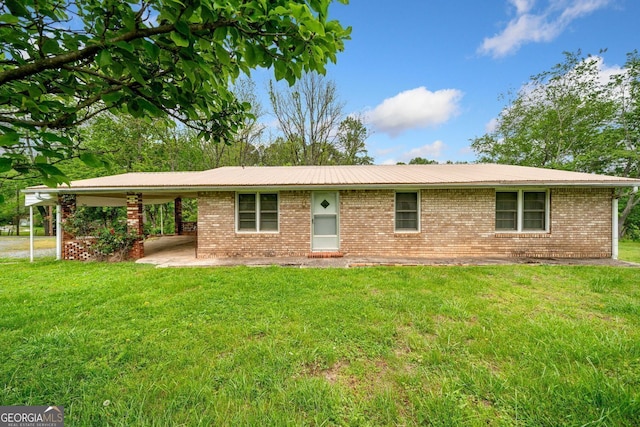 3011 Refuge Rd, Jasper, GA 30143 - ranch-style house with a front lawn, brick siding, and a carport