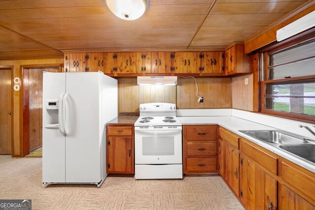 3011 Refuge Rd, Jasper, GA 30143 - kitchen with brown cabinetry, white appliances, wood ceiling, and under cabinet range hood