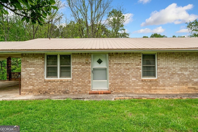 3011 Refuge Rd, Jasper, GA 30143 - single story home with metal roof, a front lawn, and brick siding