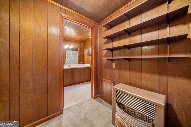 3011 Refuge Rd, Jasper, GA 30143 - interior space featuring wood walls, crown molding, heating unit, carpet flooring, and wood ceiling
