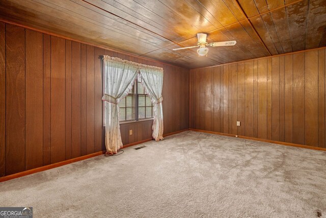 3011 Refuge Rd, Jasper, GA 30143 - carpeted spare room with wood ceiling, visible vents, ceiling fan, and wooden walls