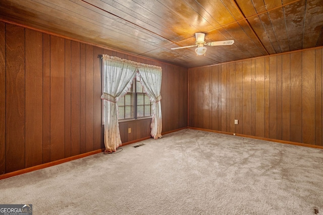 3011 Refuge Rd, Jasper, GA 30143 - spare room featuring wooden ceiling, ceiling fan, carpet flooring, and wooden walls