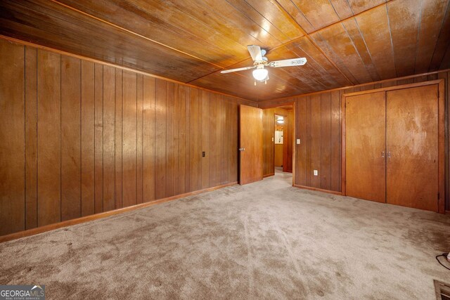 3011 Refuge Rd, Jasper, GA 30143 - unfurnished bedroom with carpet, wood ceiling, a closet, wood walls, and ceiling fan