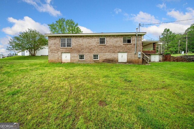 3011 Refuge Rd, Jasper, GA 30143 - back of property with a yard, brick siding, and stairway