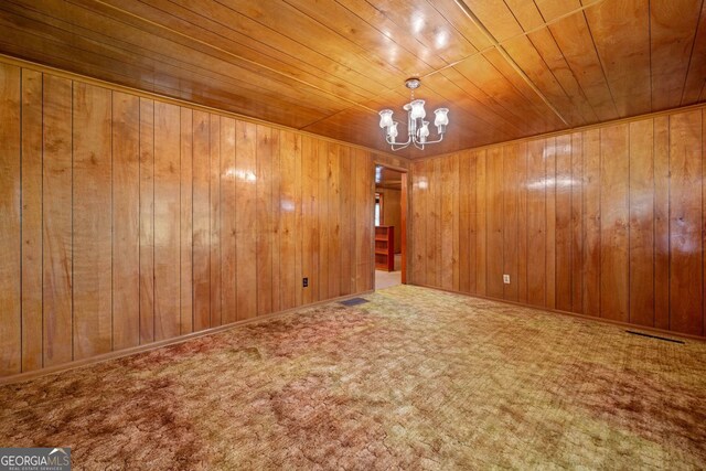 3011 Refuge Rd, Jasper, GA 30143 - carpeted spare room featuring an inviting chandelier, wooden walls, wood ceiling, and visible vents