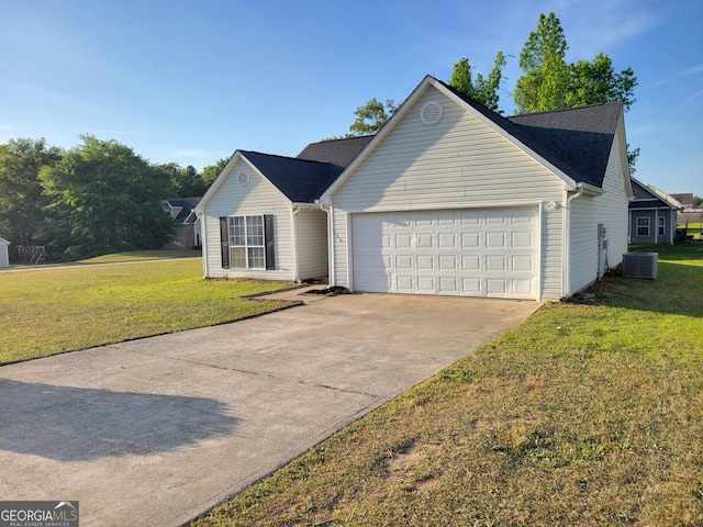 single story home featuring an attached garage, central AC unit, a front lawn, and concrete driveway