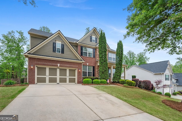 view of front of house with a garage, a front lawn, brick siding, and driveway