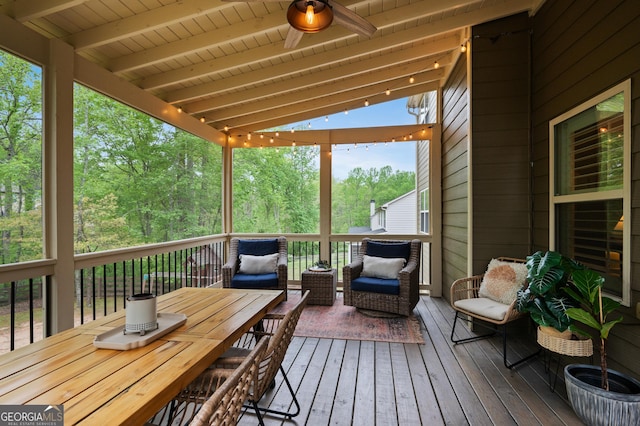 exterior space featuring beamed ceiling and ceiling fan