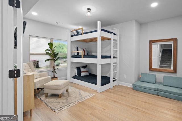 bedroom featuring recessed lighting, baseboards, visible vents, and wood finished floors