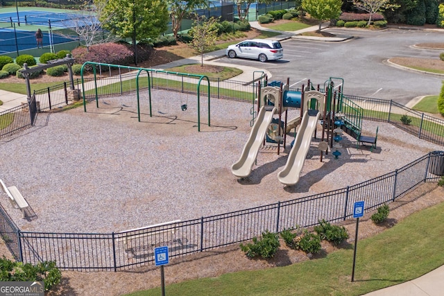 community jungle gym featuring fence