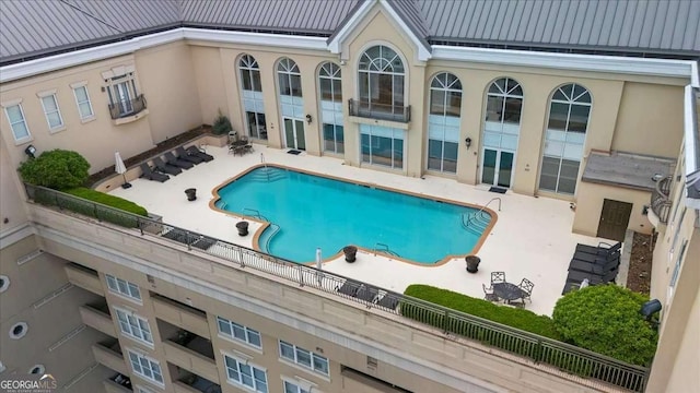 community pool with a patio