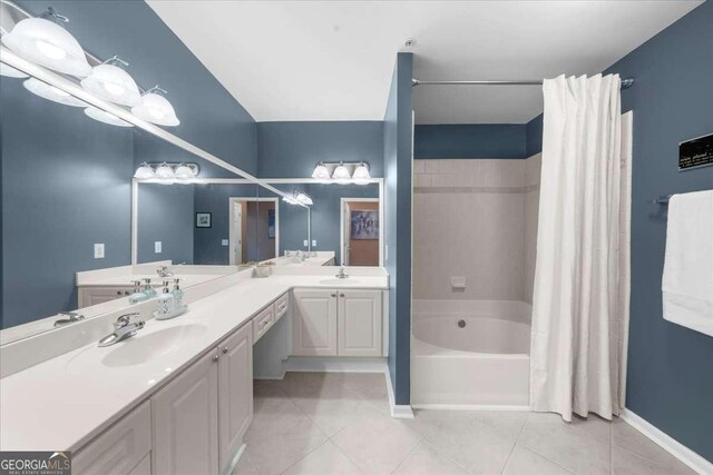 bathroom with vanity, tile patterned floors, a tub, and visible vents
