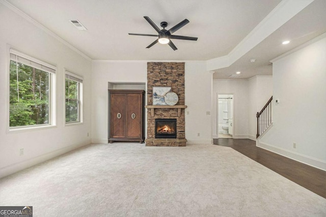 308 Evening Rain Crst, Canton, GA 30114 - unfurnished living room featuring a ceiling fan, ornamental molding, stairway, dark colored carpet, and a fireplace