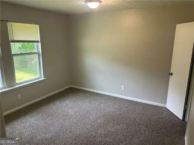 8922 Gatewood Cir, Jonesboro, GA 30238 - spare room with baseboards and carpet
