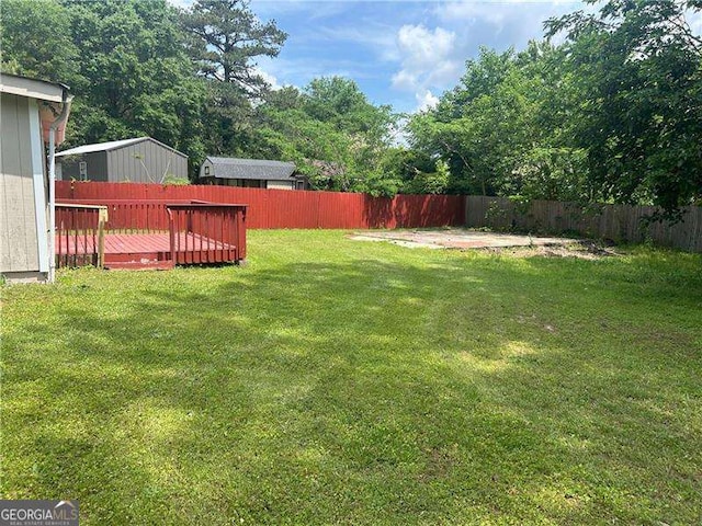8922 Gatewood Cir, Jonesboro, GA 30238 - view of yard with a fenced backyard and a wooden deck