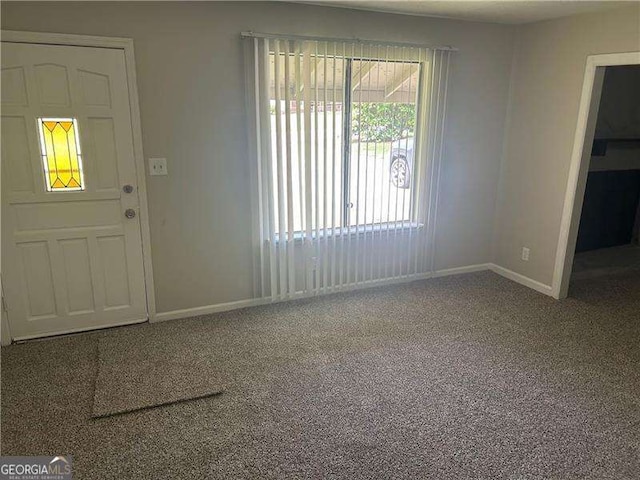 8922 Gatewood Cir, Jonesboro, GA 30238 - foyer with carpet flooring and baseboards