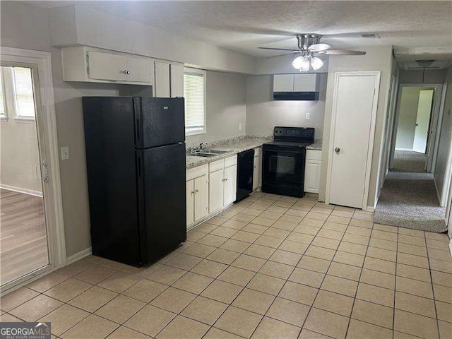 8922 Gatewood Cir, Jonesboro, GA 30238 - kitchen with a sink, a textured ceiling, white cabinetry, range hood, and black appliances