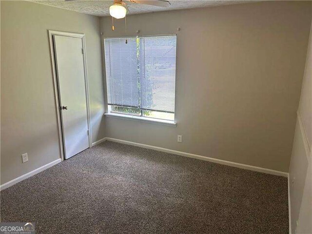 8922 Gatewood Cir, Jonesboro, GA 30238 - carpeted empty room featuring a ceiling fan, baseboards, and a textured ceiling